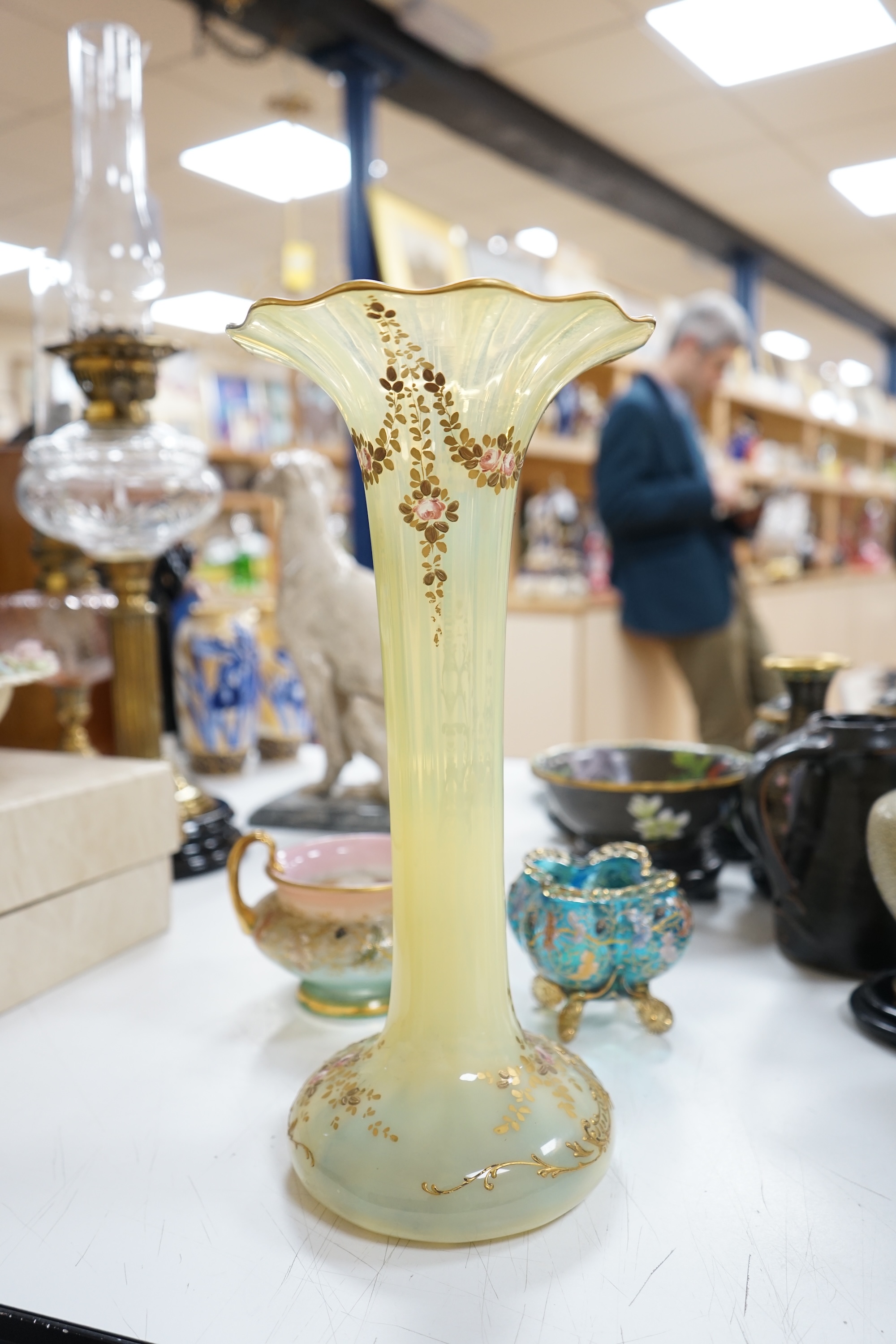 Three Bohemian gilt decorated glass vessels, including two Moser bowls and a tall Vaseline vase, 34.5cm high. Condition - good.